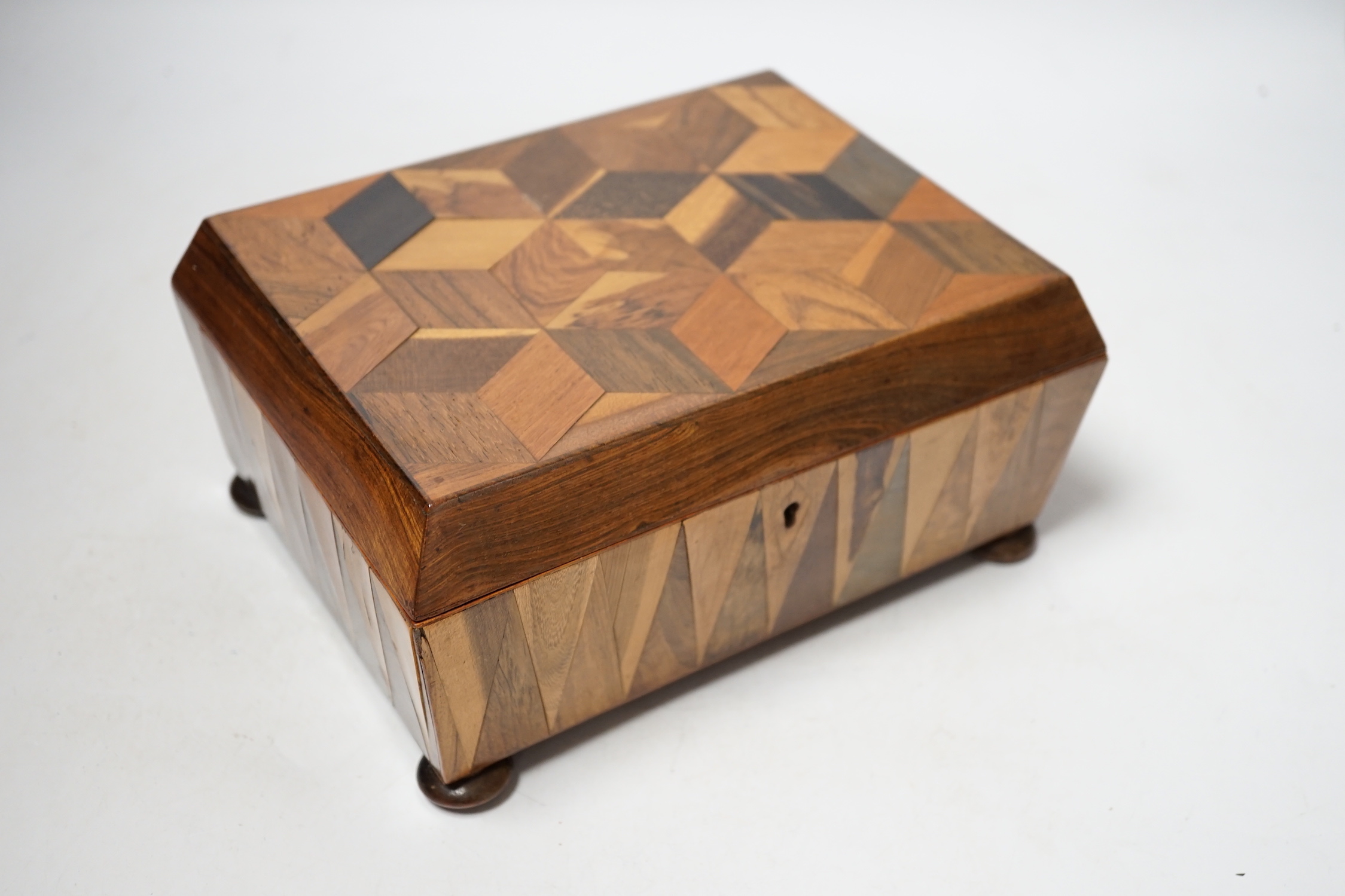 A Victorian specimen wood perspective cube parquetry workbox and contents, 22cm